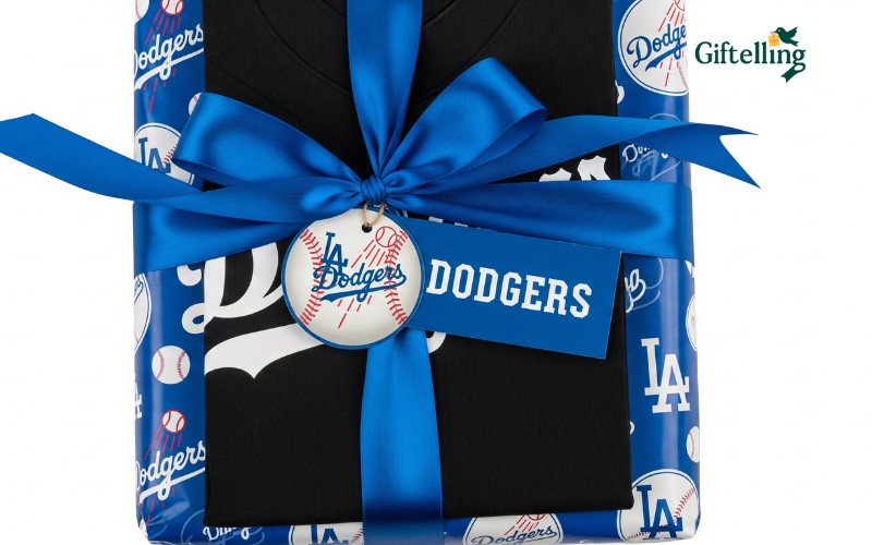 Gift wrapped black Dodgers jersey with blue ribbon and Dodgers themed gift card and packaging