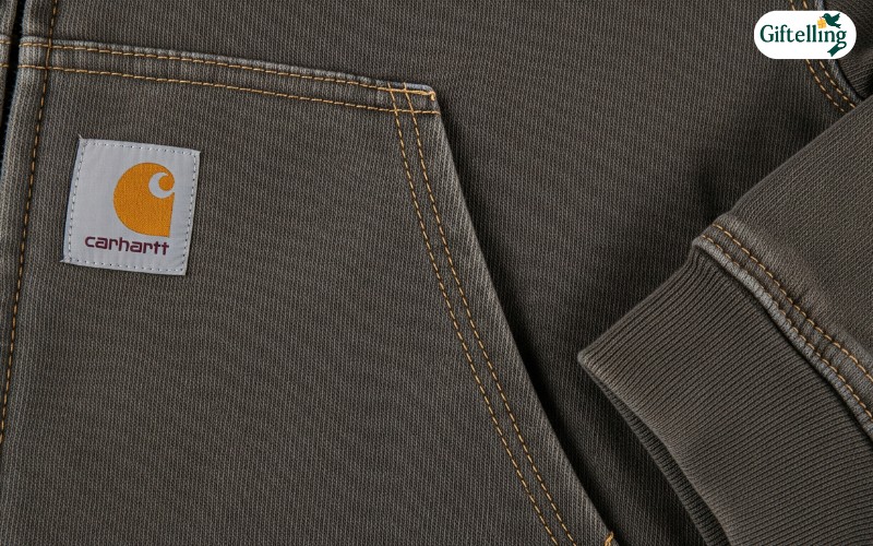 Close-up view of Carhartt hoodie fabric showing heavyweight construction and quality stitching details