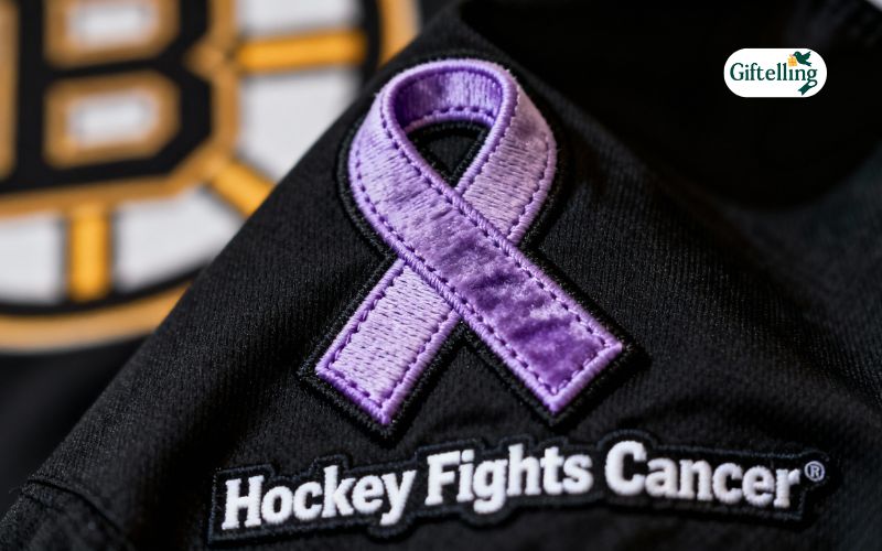 Close-up detail of purple lavender cancer awareness ribbon on Bruins Hockey Fights Cancer jersey