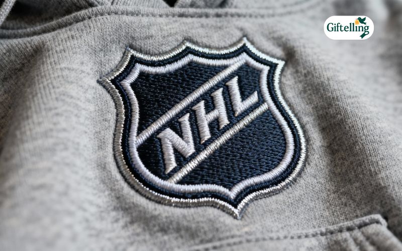 Close-up of embroidered NHL team logo on premium quality hockey hoodie showing dimensional stitching