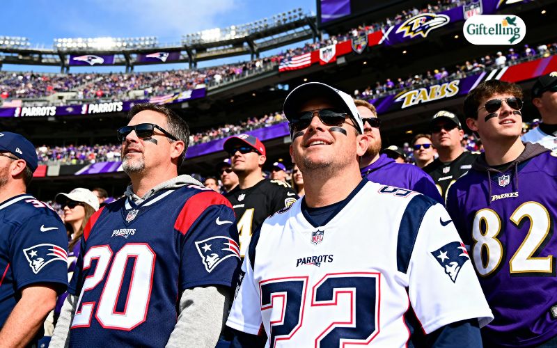 Patriots vs Ravens game day showing fans wearing team jerseys in stadium with New England and Baltimore colors